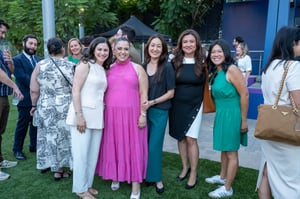 Guests pose for a photo at the Central City Association’s Elected Officials and Chiefs of Staff Reception at LA Plaza de Cultura y Artes in Downtown Los Angeles, engaging in conversation in a lively outdoor setting.